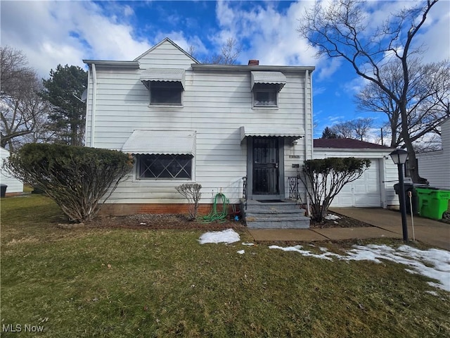 view of front of house featuring a garage, a chimney, concrete driveway, and a front lawn
