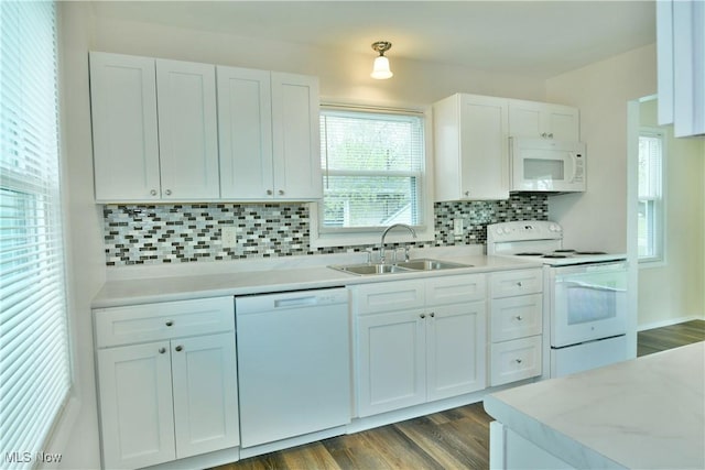 5071 Copeland Ave NW, Warren, OH 44483 - kitchen with tasteful backsplash, a sink, light countertops, white appliances, and white cabinetry