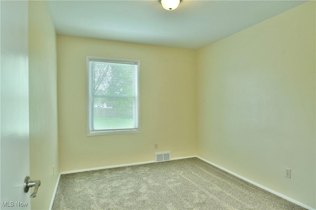 5071 Copeland Ave NW, Warren, OH 44483 - carpeted spare room with baseboards and visible vents