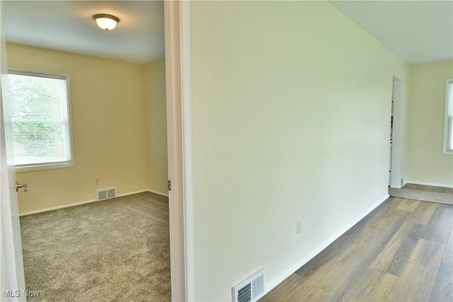 5071 Copeland Ave NW, Warren, OH 44483 - empty room featuring visible vents, baseboards, and wood finished floors