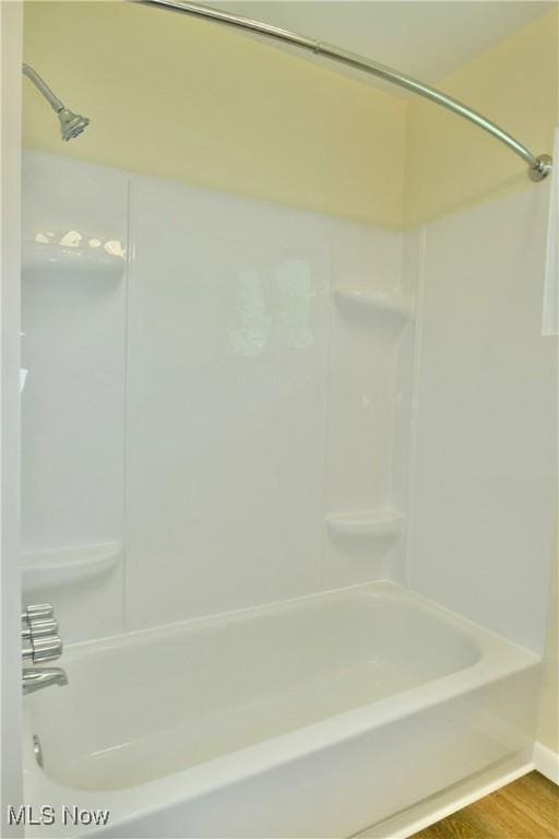 5071 Copeland Ave NW, Warren, OH 44483 - full bath featuring shower / bath combination, baseboards, and wood finished floors