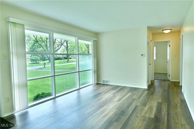 5071 Copeland Ave NW, Warren, OH 44483 - unfurnished room featuring baseboards, wood finished floors, and visible vents