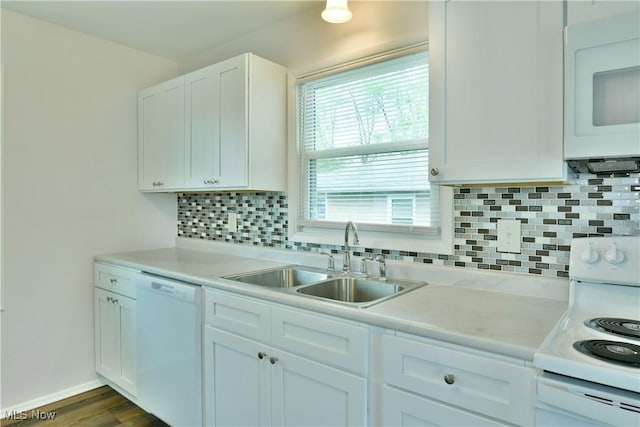 5071 Copeland Ave NW, Warren, OH 44483 - kitchen featuring a sink, light countertops, backsplash, and white appliances