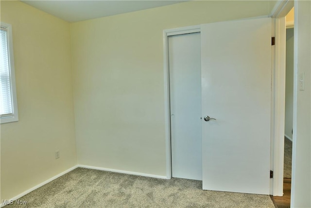 5071 Copeland Ave NW, Warren, OH 44483 - unfurnished bedroom featuring baseboards, carpet flooring, and a closet