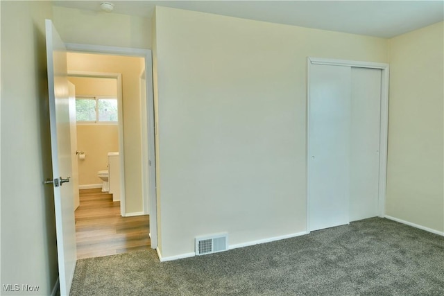 5071 Copeland Ave NW, Warren, OH 44483 - unfurnished bedroom featuring carpet floors, baseboards, a closet, and visible vents
