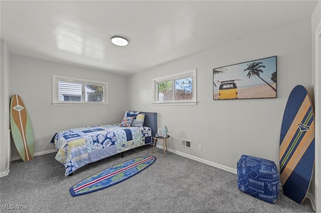 bedroom with baseboards, carpet flooring, and visible vents