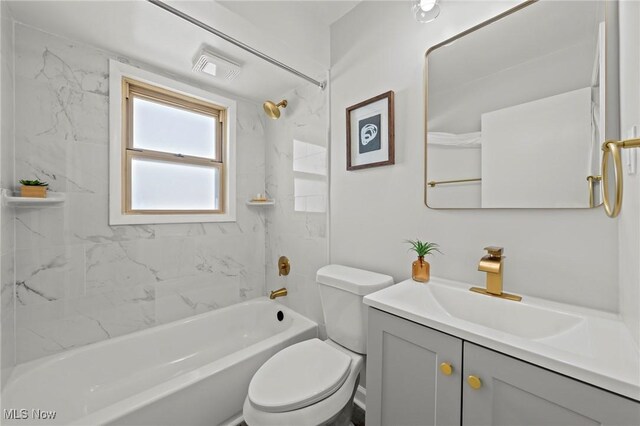 bathroom with vanity, shower / bathtub combination, visible vents, and toilet