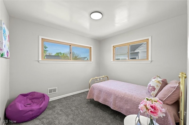 bedroom with visible vents, carpet flooring, and baseboards