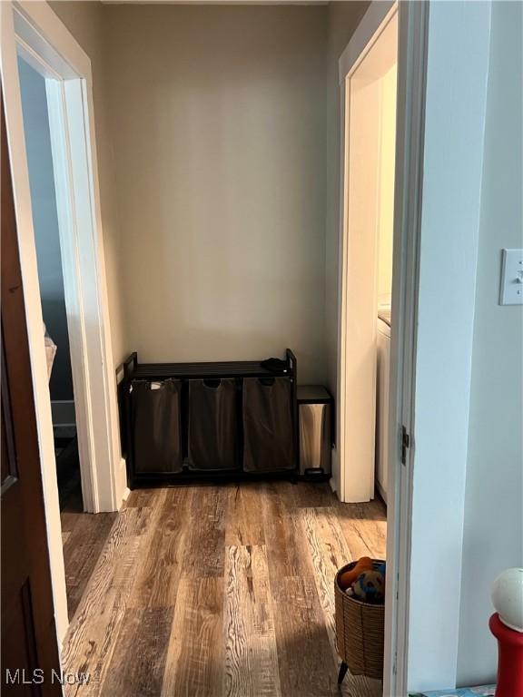 hall with wood finished floors