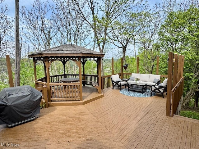 wooden deck with a gazebo, an outdoor living space, and grilling area
