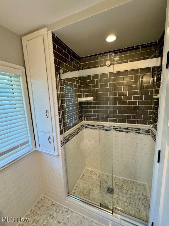 bathroom with recessed lighting and a shower stall