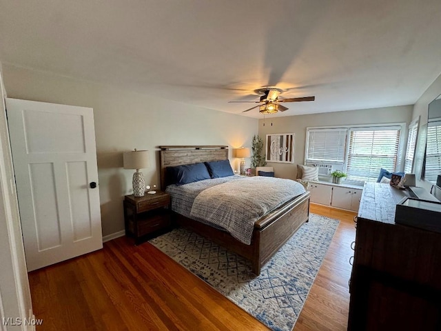 bedroom featuring a ceiling fan and wood finished floors