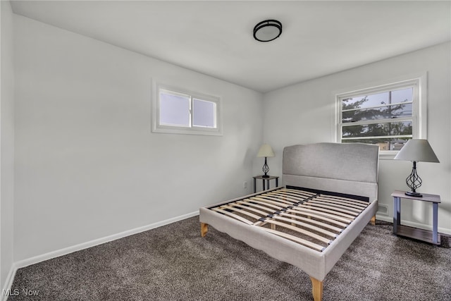 carpeted bedroom with baseboards