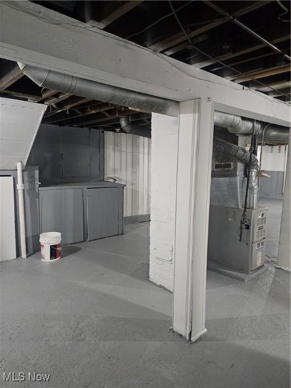 unfinished basement with heating unit