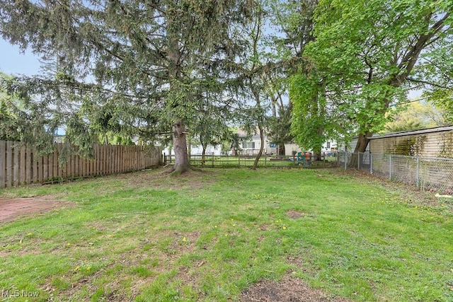 23267 Marion Rd, North Olmsted, OH 44070 - view of yard with a fenced backyard