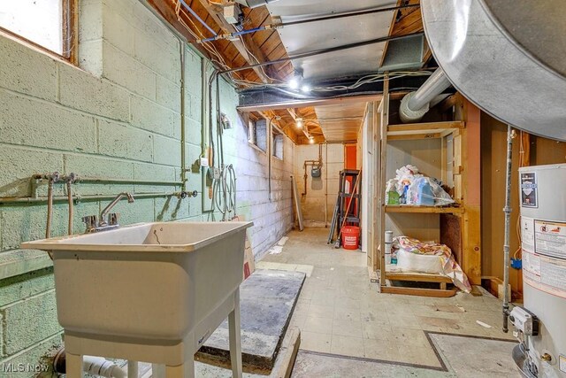 23267 Marion Rd, North Olmsted, OH 44070 - unfinished basement featuring water heater and concrete block wall