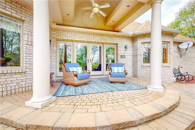view of patio / terrace featuring ceiling fan and french doors