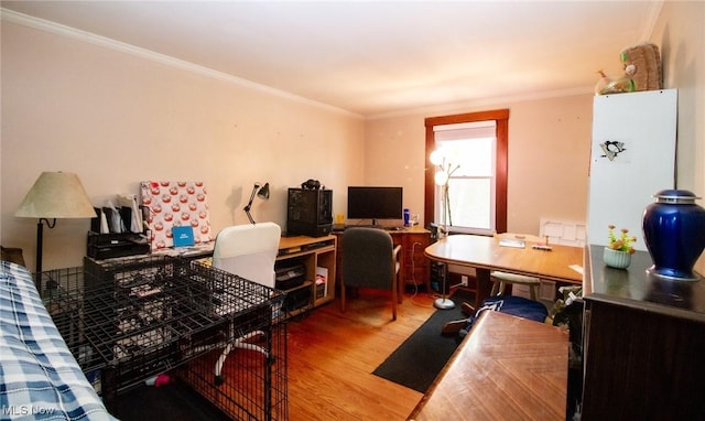 home office featuring crown molding and wood finished floors