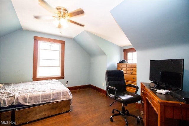 bedroom with a ceiling fan, baseboards, wood finished floors, and lofted ceiling