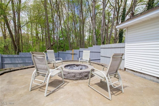 view of patio / terrace with fence and an outdoor fire pit