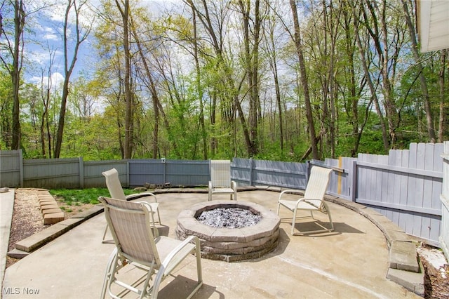 view of patio / terrace featuring a fire pit and a fenced backyard