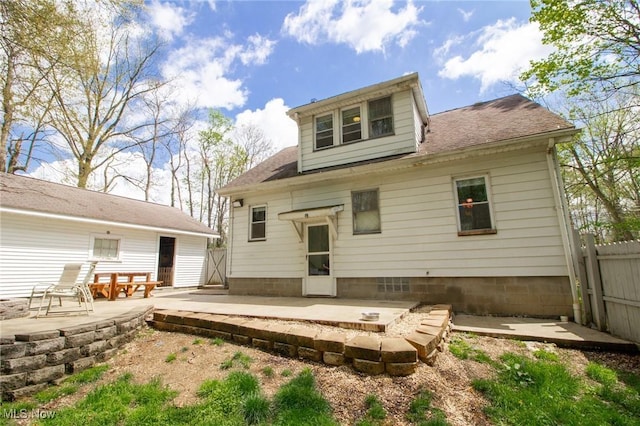 back of house featuring a patio, roof with shingles, and fence