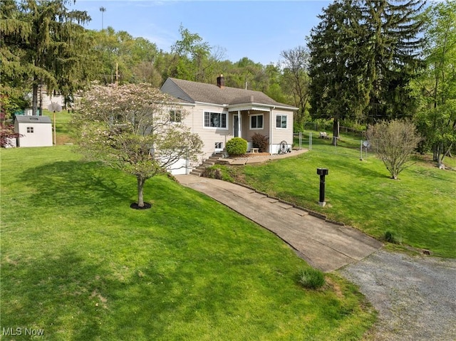 23 Walnut St, Rayland, OH 43943 - ranch-style house featuring a chimney, driveway, and a front lawn