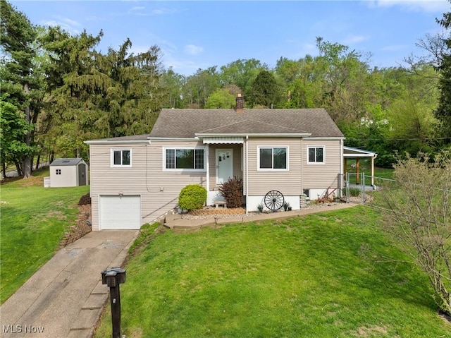 23 Walnut St, Rayland, OH 43943 - view of front facade featuring a storage shed, a garage, an outdoor structure, a front lawn, and concrete driveway