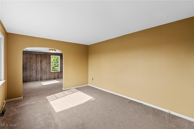 23 Walnut St, Rayland, OH 43943 - spare room with arched walkways, baseboards, carpet, and visible vents