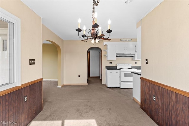 23 Walnut St, Rayland, OH 43943 - kitchen featuring electric range, an inviting chandelier, light carpet, arched walkways, and under cabinet range hood