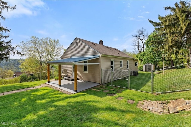 23 Walnut St, Rayland, OH 43943 - back of house with a shed, a fenced backyard, a gate, a patio, and a yard