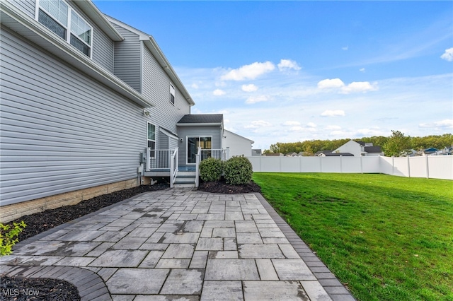 view of patio / terrace with fence and a deck