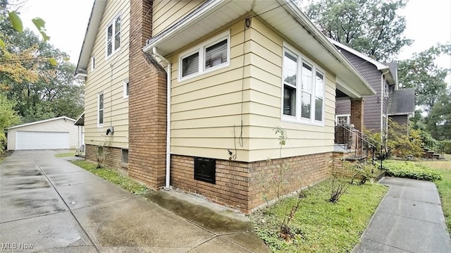 3996 Bluestone Rd, Cleveland Heights, OH 44121 - view of side of home with an outbuilding and a garage