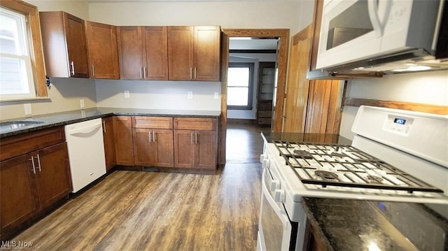3996 Bluestone Rd, Cleveland Heights, OH 44121 - kitchen featuring brown cabinets, dark wood-style floors, and white appliances