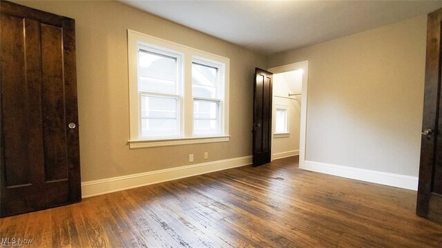 3996 Bluestone Rd, Cleveland Heights, OH 44121 - unfurnished bedroom with baseboards and wood finished floors