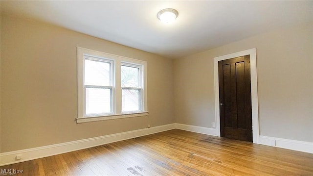 3996 Bluestone Rd, Cleveland Heights, OH 44121 - empty room with baseboards and wood finished floors
