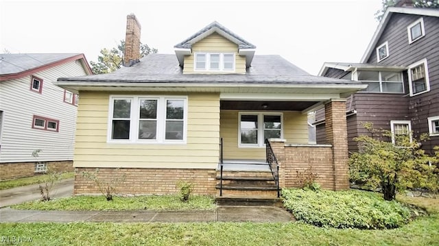 3996 Bluestone Rd, Cleveland Heights, OH 44121 - bungalow-style home featuring a porch and a chimney