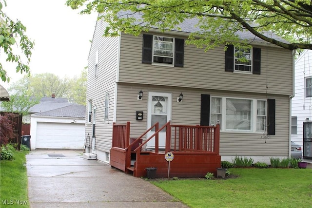 864 Davies Ave, Akron, OH 44306 - colonial home with concrete driveway, an outbuilding, a front yard, and a detached garage