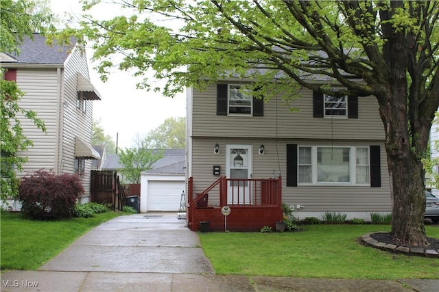 864 Davies Ave, Akron, OH 44306 - colonial-style house with a garage, a front lawn, and an outbuilding