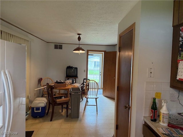 919 19th St, Vienna, WV 26105 - dining space with light flooring and a textured ceiling