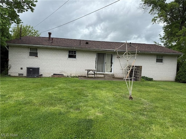 919 19th St, Vienna, WV 26105 - back of house with central AC, a yard, brick siding, and a patio