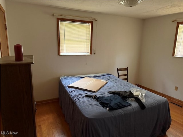 919 19th St, Vienna, WV 26105 - bedroom featuring light wood-style flooring and baseboards