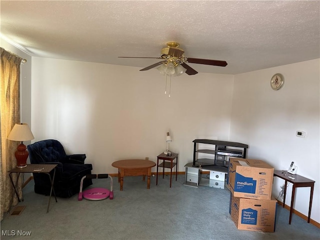 919 19th St, Vienna, WV 26105 - living area featuring carpet, ceiling fan, a textured ceiling, and baseboards