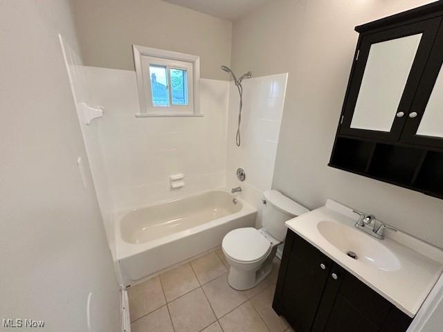 30119 Harrison St, Willowick, OH 44095 - bathroom featuring vanity,  shower combination, tile patterned floors, and toilet
