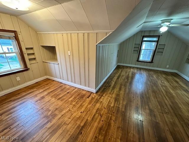 30119 Harrison St, Willowick, OH 44095 - additional living space with baseboards, a ceiling fan, vaulted ceiling, and hardwood / wood-style flooring