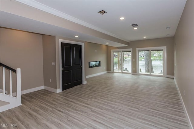 unfurnished living room with recessed lighting, baseboards, visible vents, and light wood-style flooring