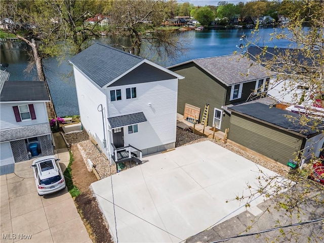 birds eye view of property with a water view