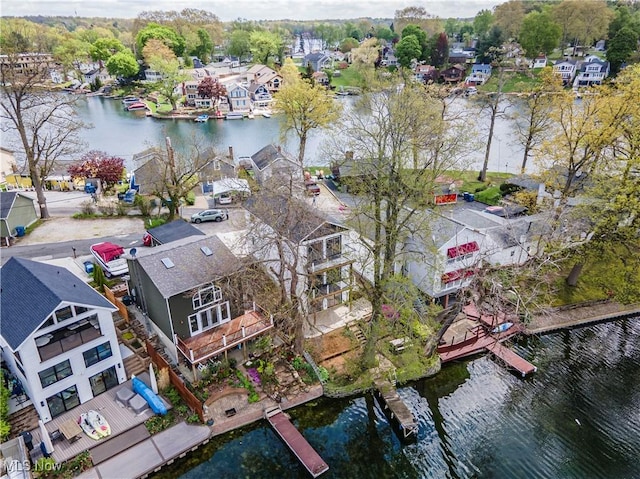 bird's eye view with a water view and a residential view