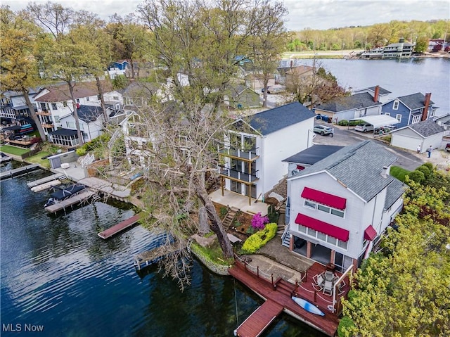 birds eye view of property with a residential view and a water view