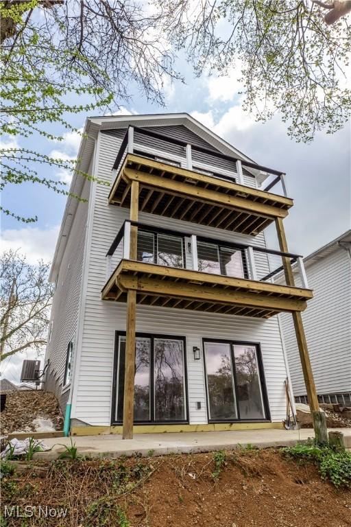 back of house with a balcony